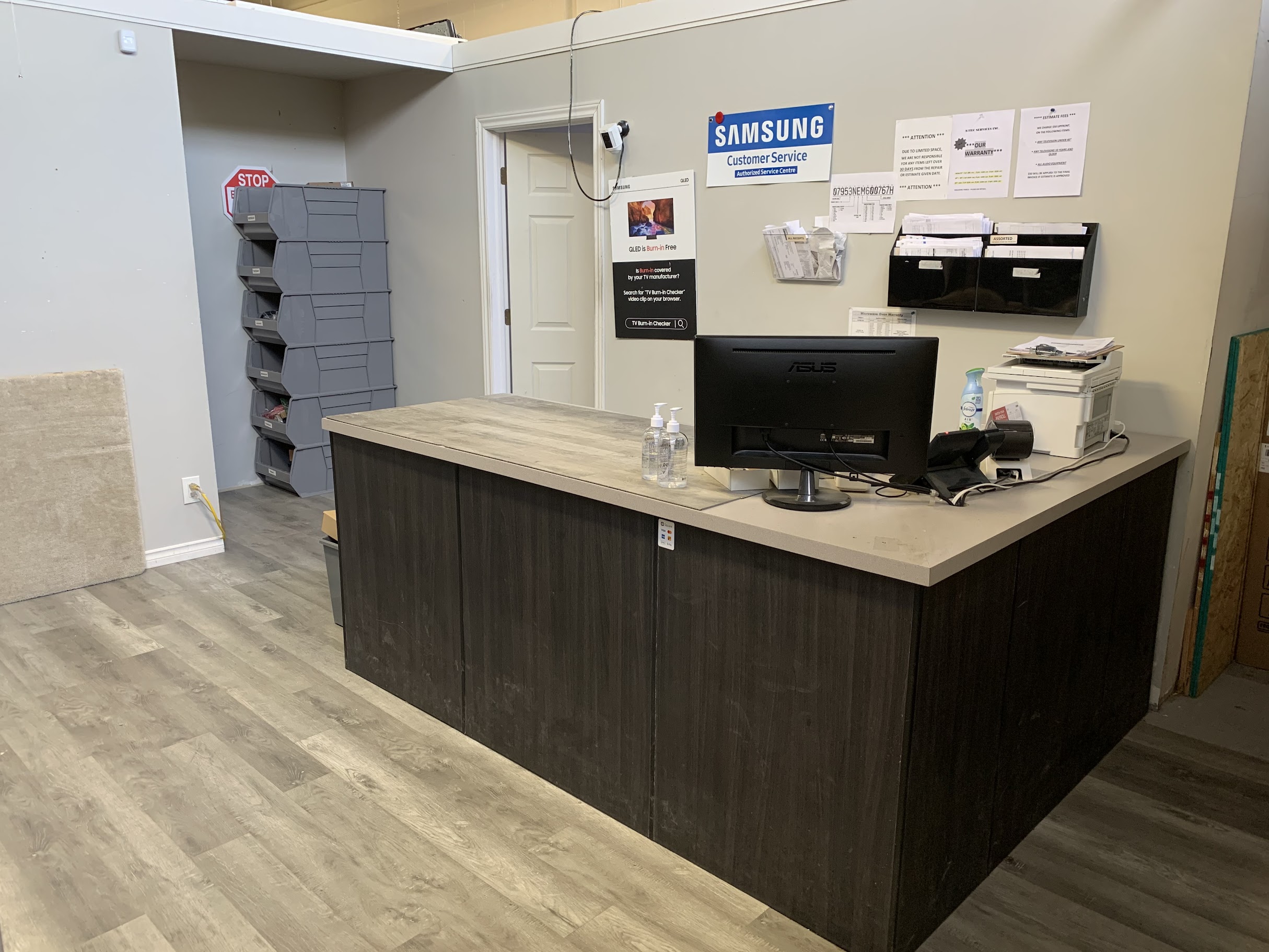 A1tek Services reception desk with Samsung authorized service centre sign in Scarborough